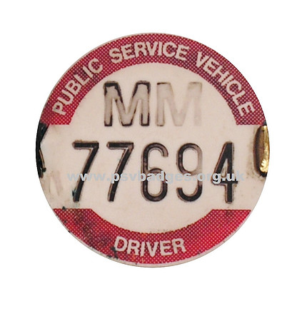 MM 77694 Early embossed plastic badge.