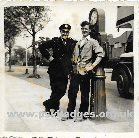 Birmingham City Transport crew standing by a Bundy time clock.